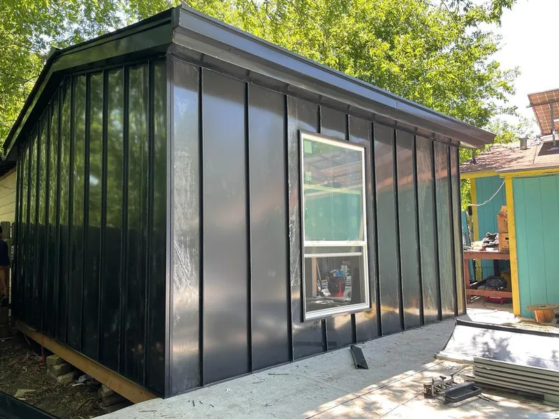 Black standing seam metal wall panels for Metal Roof Installation in Corcoran