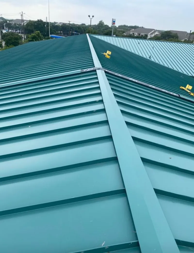 Green commercial metal roof ridge and valley for Metal Roof Repair in Corcoran